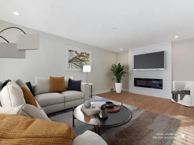 a living room with furniture and a fireplace