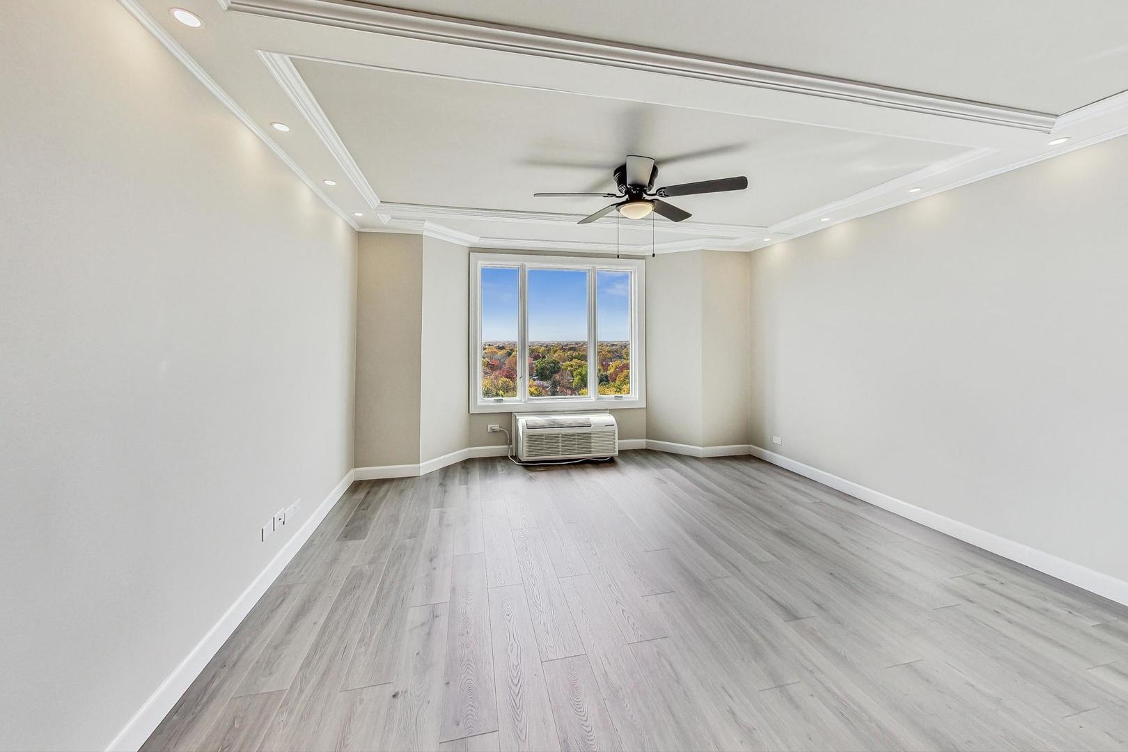 1 Renaissance Place, Unit 1220 Palatine, IL 60067 - Photo 1 of 9 a view of a room with wooden floor ceiling fan and window