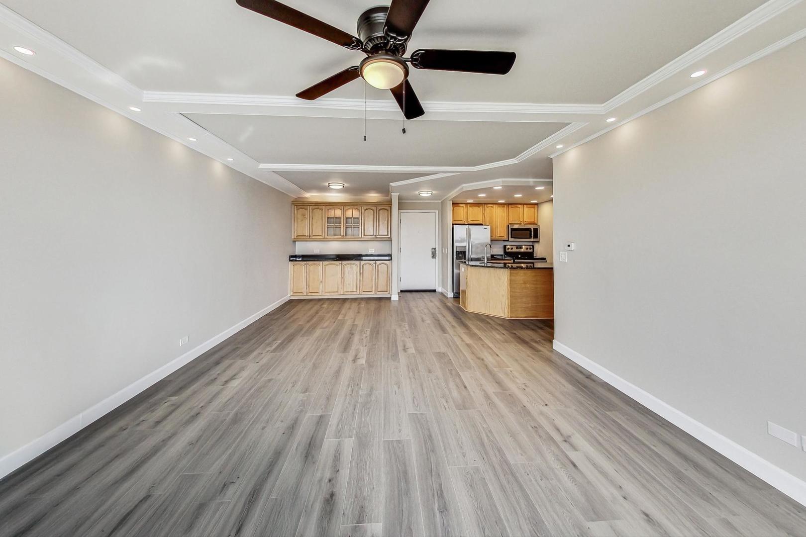 1 Renaissance Place, Unit 1220 Palatine, IL 60067 - Photo 3 of 9 a view of a kitchen with a wooden floor and stainless steel appliances