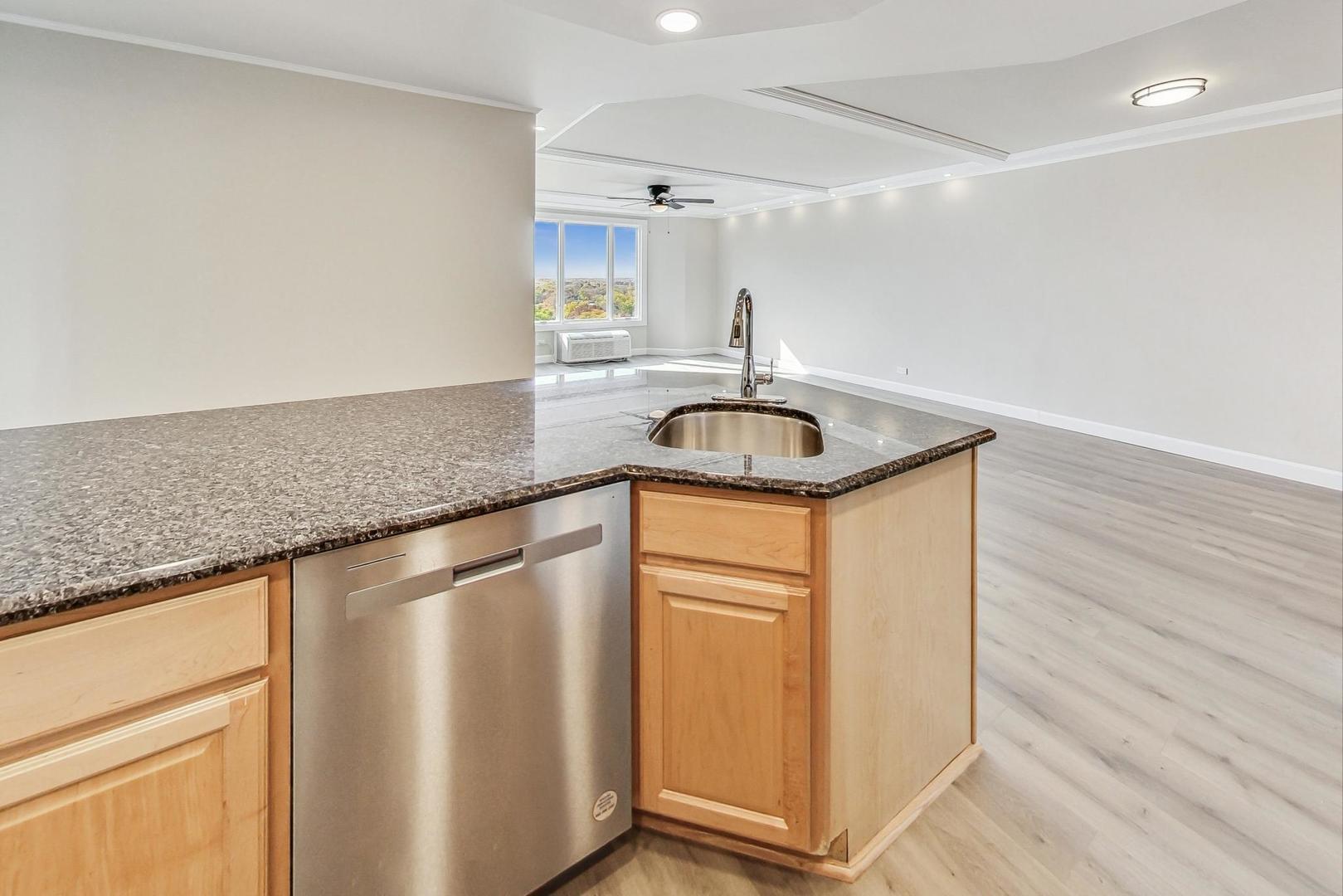 1 Renaissance Place, Unit 1220 Palatine, IL 60067 - Photo 8 of 9 a kitchen with a sink and a refrigerator