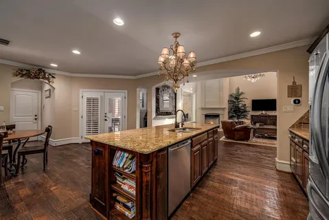 a large kitchen with lots of counter space and center island