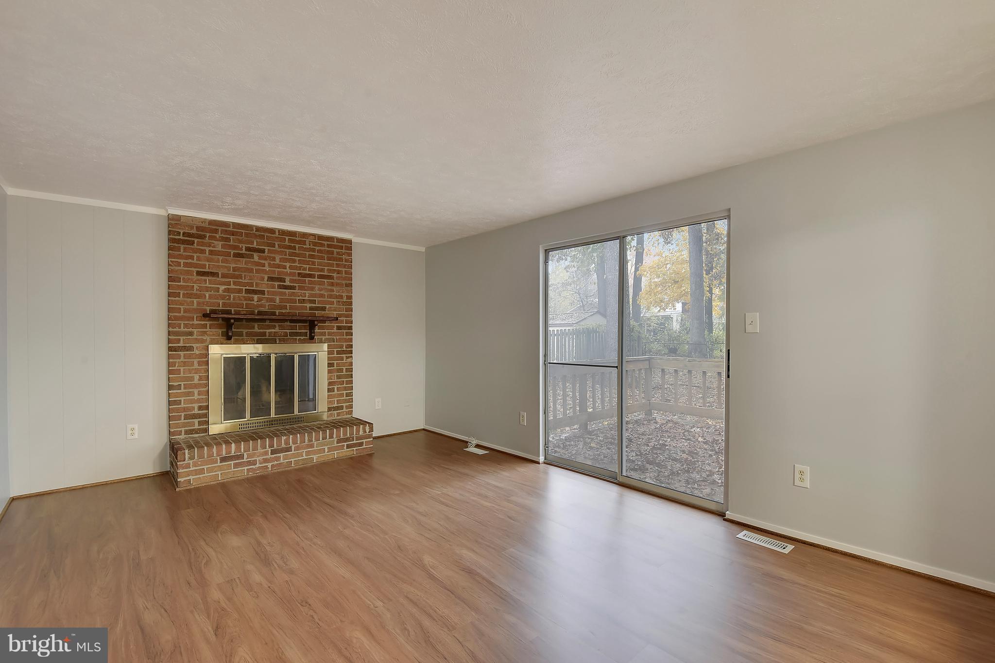 5729 Heming Avenue Springfield, VA 22151 - Photo 14 of 49 Family room with cozy brick fireplace