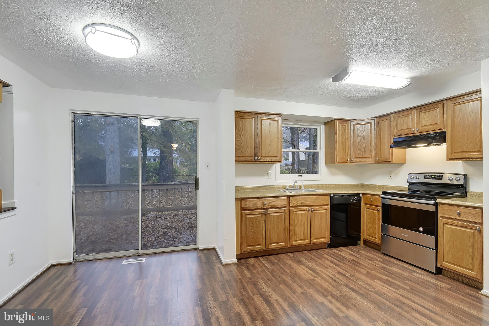 5729 Heming Avenue Springfield, VA 22151 - Photo 5 of 49 Dining area with sliding glass doors to the deck