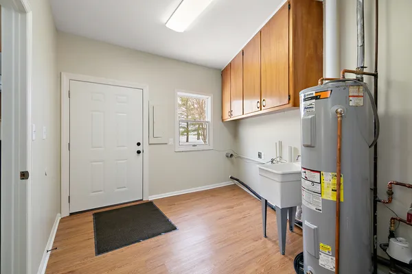 a kitchen with stainless steel appliances a refrigerator and a window