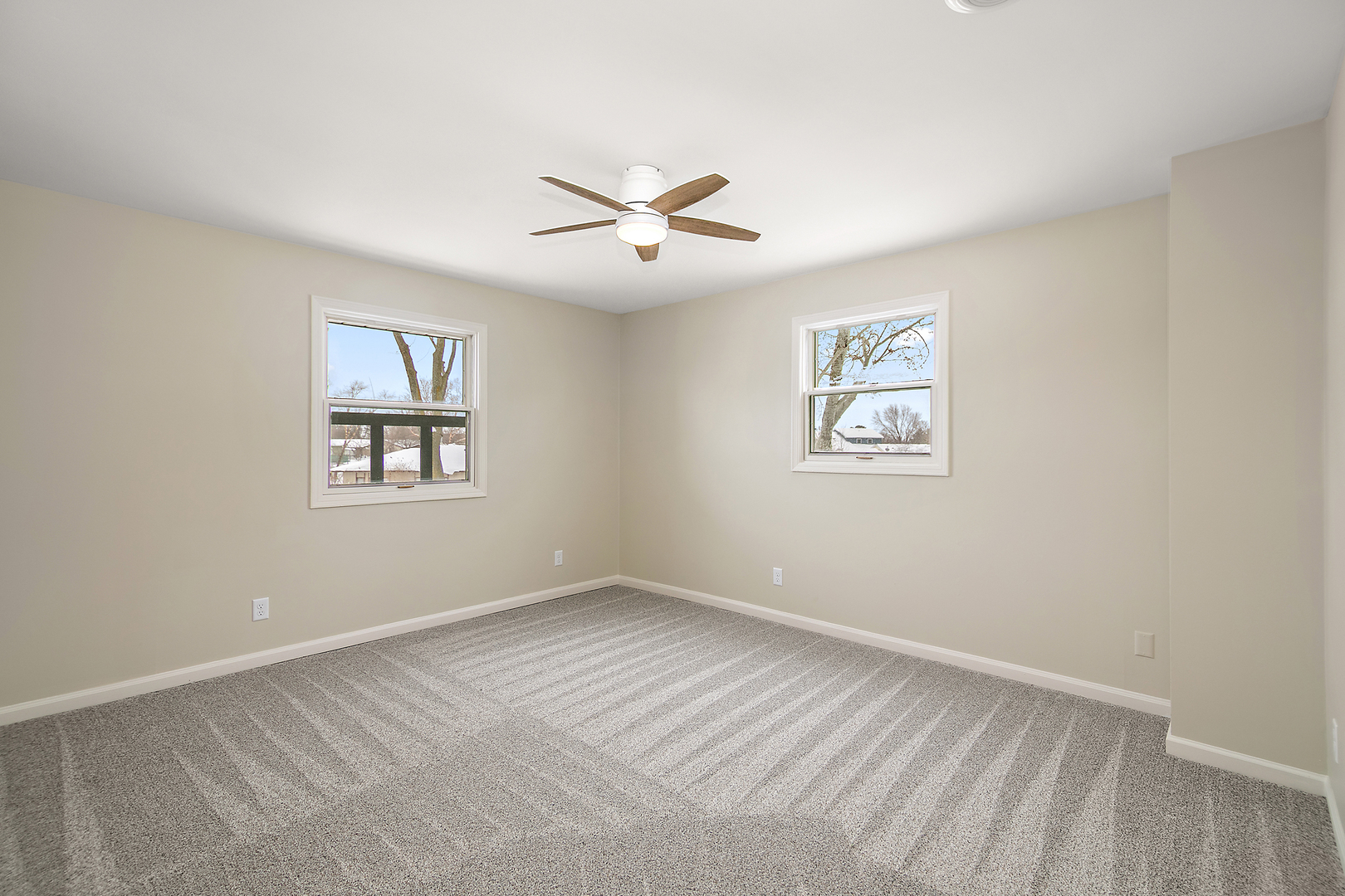 101 Sun Street, Unit A Cabery, IL 60919 - Photo 17 of 26 an empty room with windows and fan
