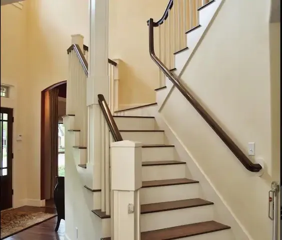 a view of a dining room with furniture and a chandelier