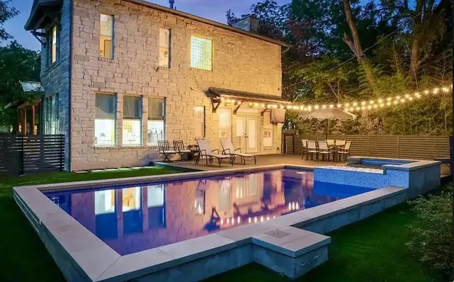 a view of swimming pool with outdoor seating