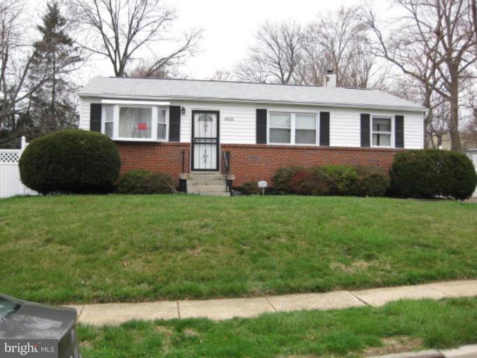 4050 Carthage Road Randallstown, MD 21133 - Photo 1 of 1 a front view of a house with a yard and trees