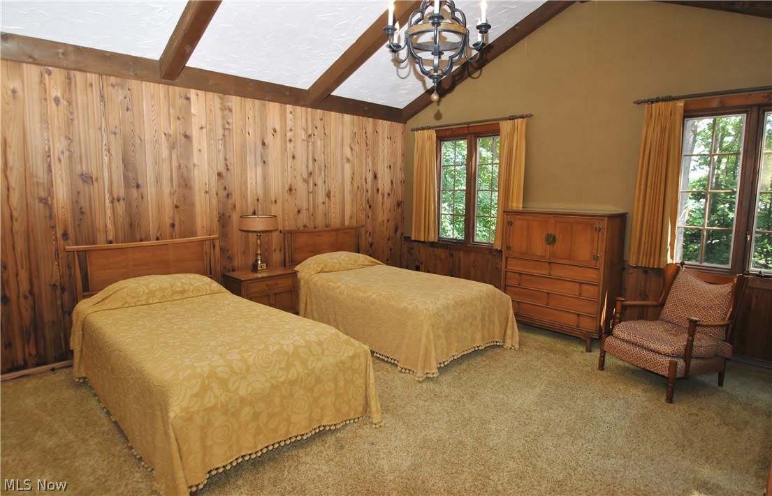 2250 Lancaster Road Akron, OH 44313 - Photo 20 of 35 Bedroom #3 has cathedral beamed ceiling, wood paneled wall and walk-in closet.