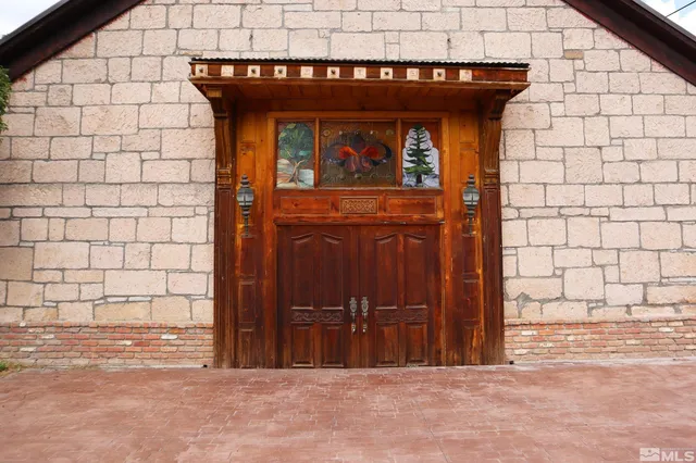 a view of a wooden door of the house