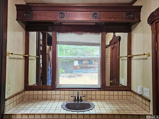 a bathroom with a tub and a shower