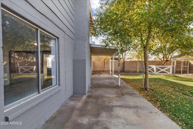 a view of a garden with a patio
