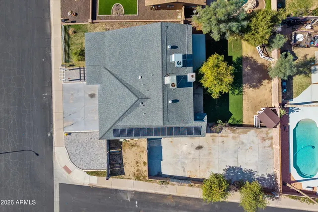 an aerial view of residential houses with outdoor space