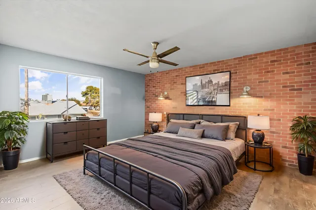 a living room with furniture a rug and a window