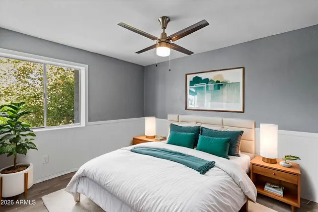 a bedroom with a bed and a book shelf