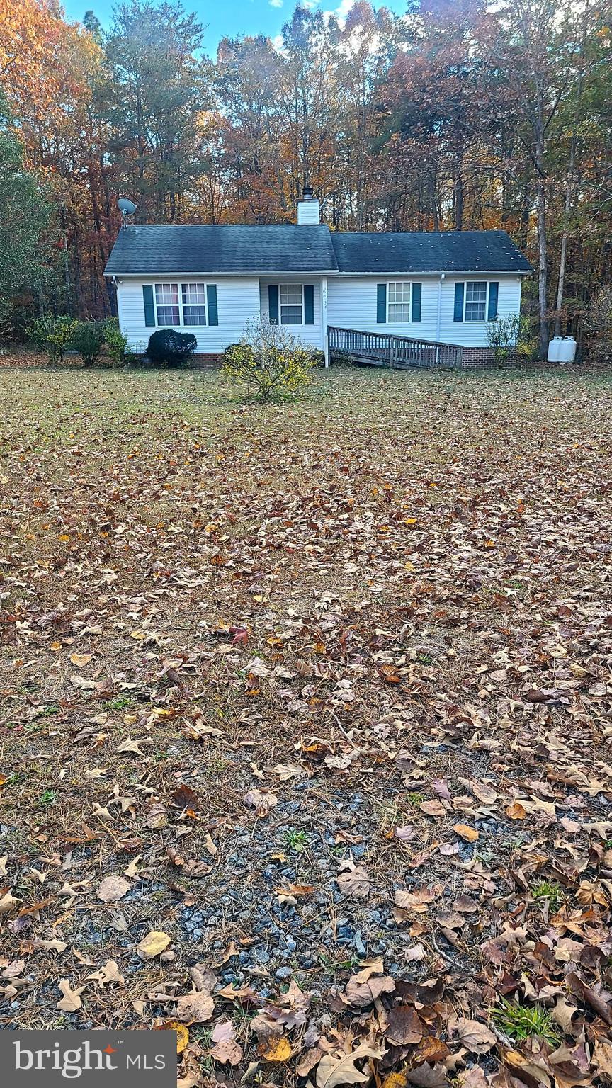 10056 Carters Lane Ruther Glen, VA 22546 - Photo 1 of 1 a brick house with a large yard