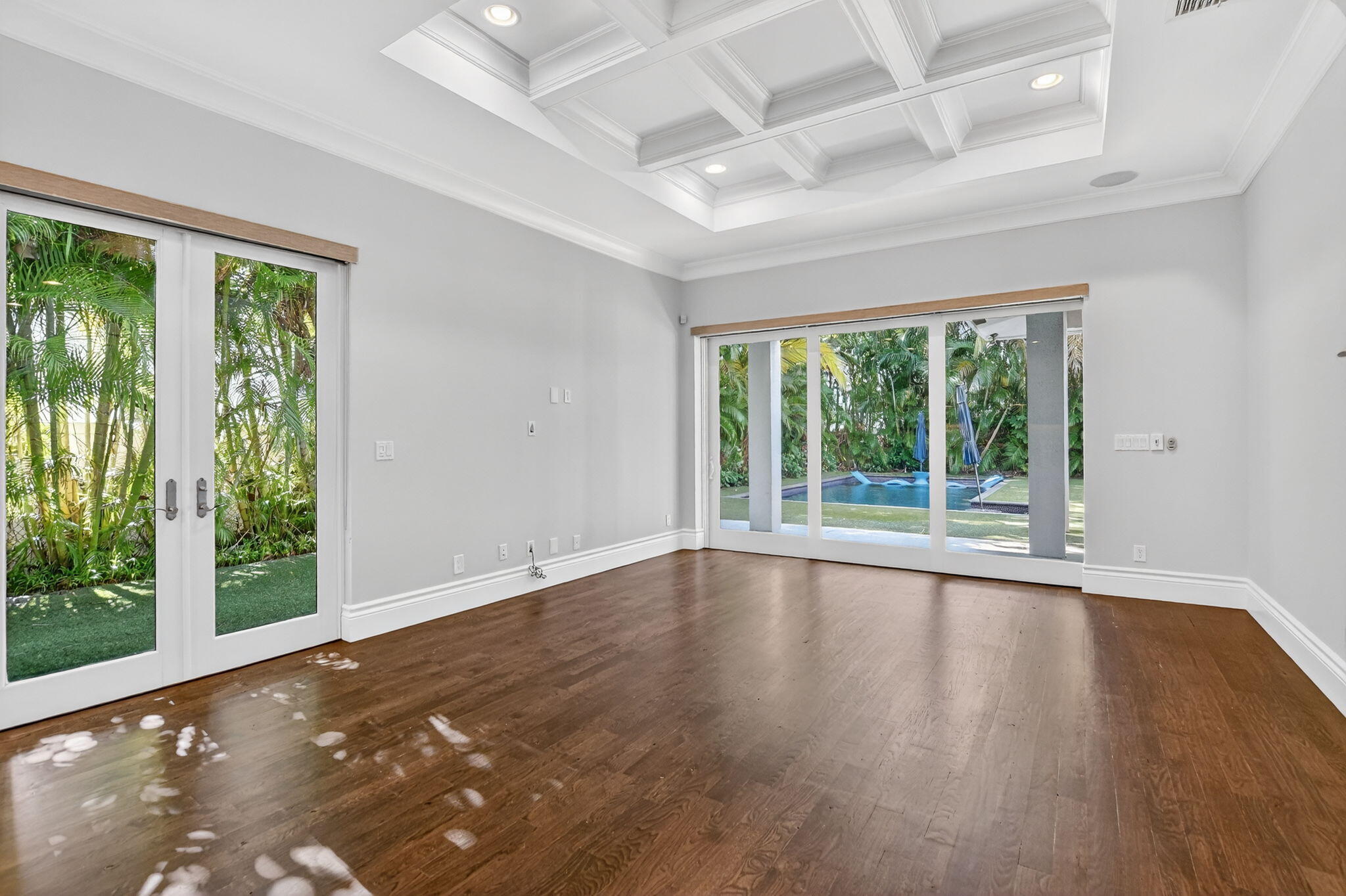 200 Northwest 10th Street Boca Raton, FL 33432 - Photo 14 of 83 a view of an empty room with wooden floor and a window