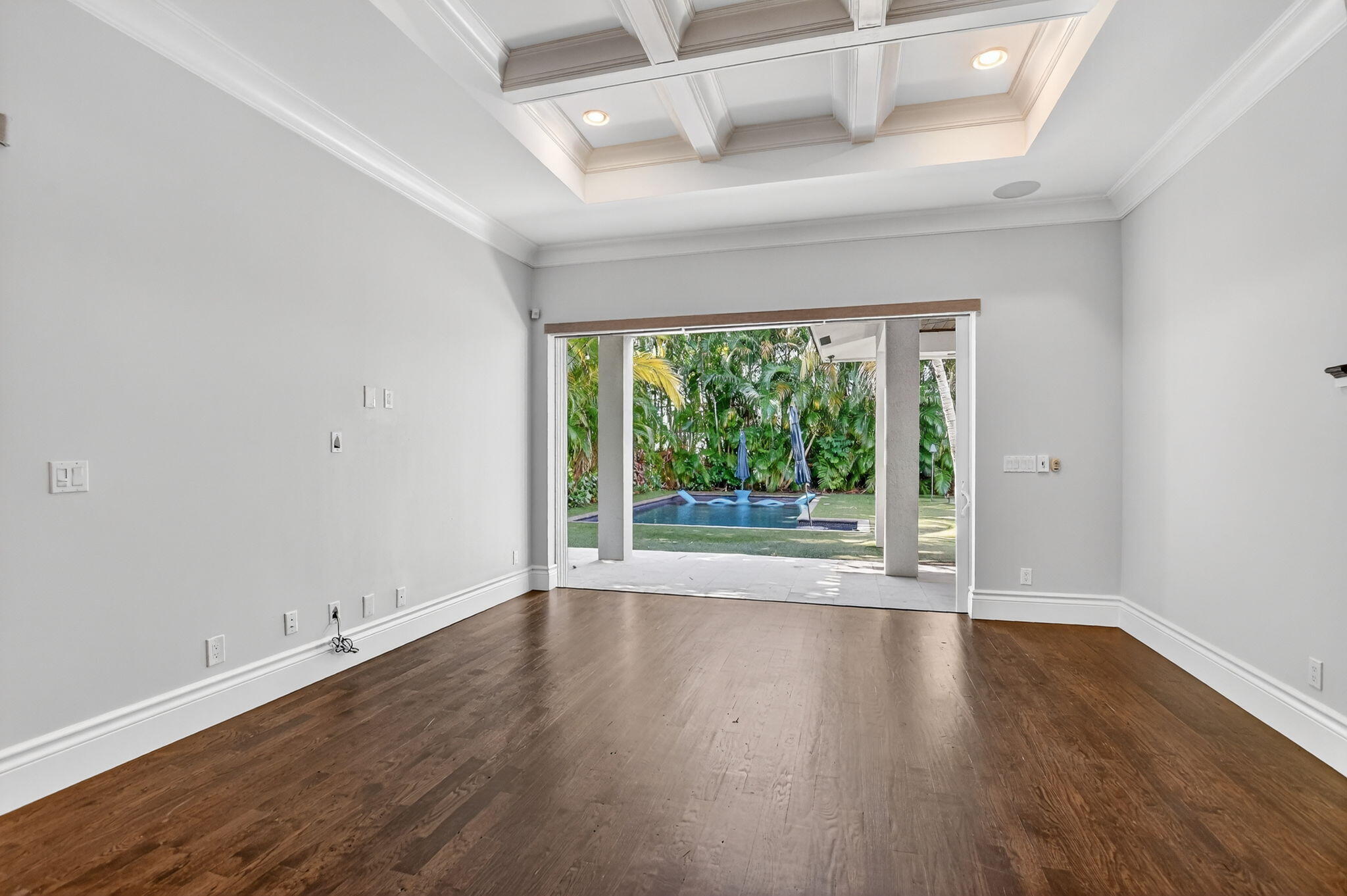 200 Northwest 10th Street Boca Raton, FL 33432 - Photo 16 of 83 a view of an empty room with wooden floor and a window