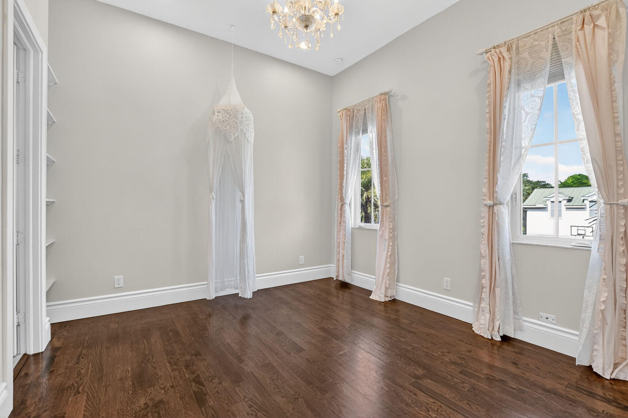 200 Northwest 10th Street Boca Raton, FL 33432 - Photo 41 of 83 an empty room with wooden floor cabinet and windows