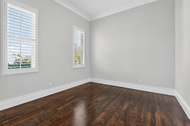 a view of water heater room with window and entryway