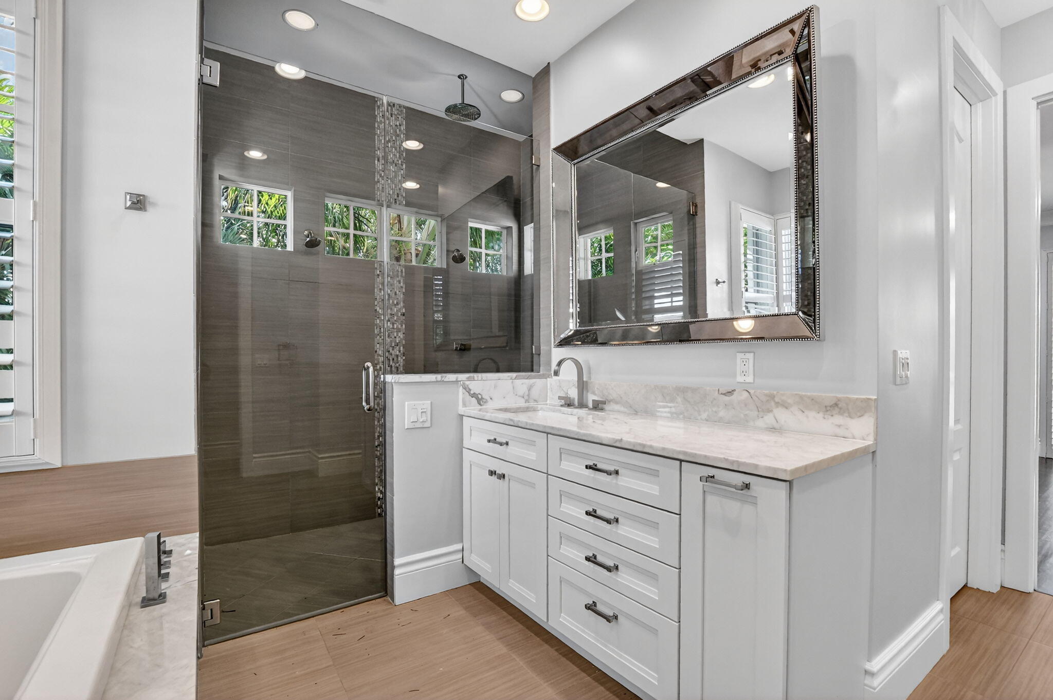 200 Northwest 10th Street Boca Raton, FL 33432 - Photo 53 of 83 a bathroom with a granite countertop sink a mirror and a shower