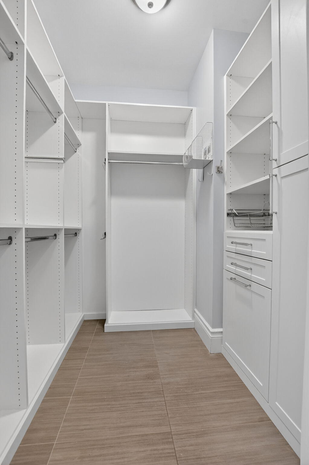 200 Northwest 10th Street Boca Raton, FL 33432 - Photo 55 of 83 a view of walk in closet with empty racks