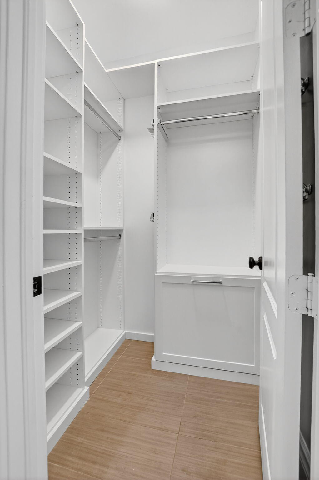 200 Northwest 10th Street Boca Raton, FL 33432 - Photo 56 of 83 a view of walk in closet with empty racks