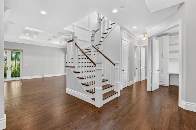 a view of entryway with wooden floor and stairs
