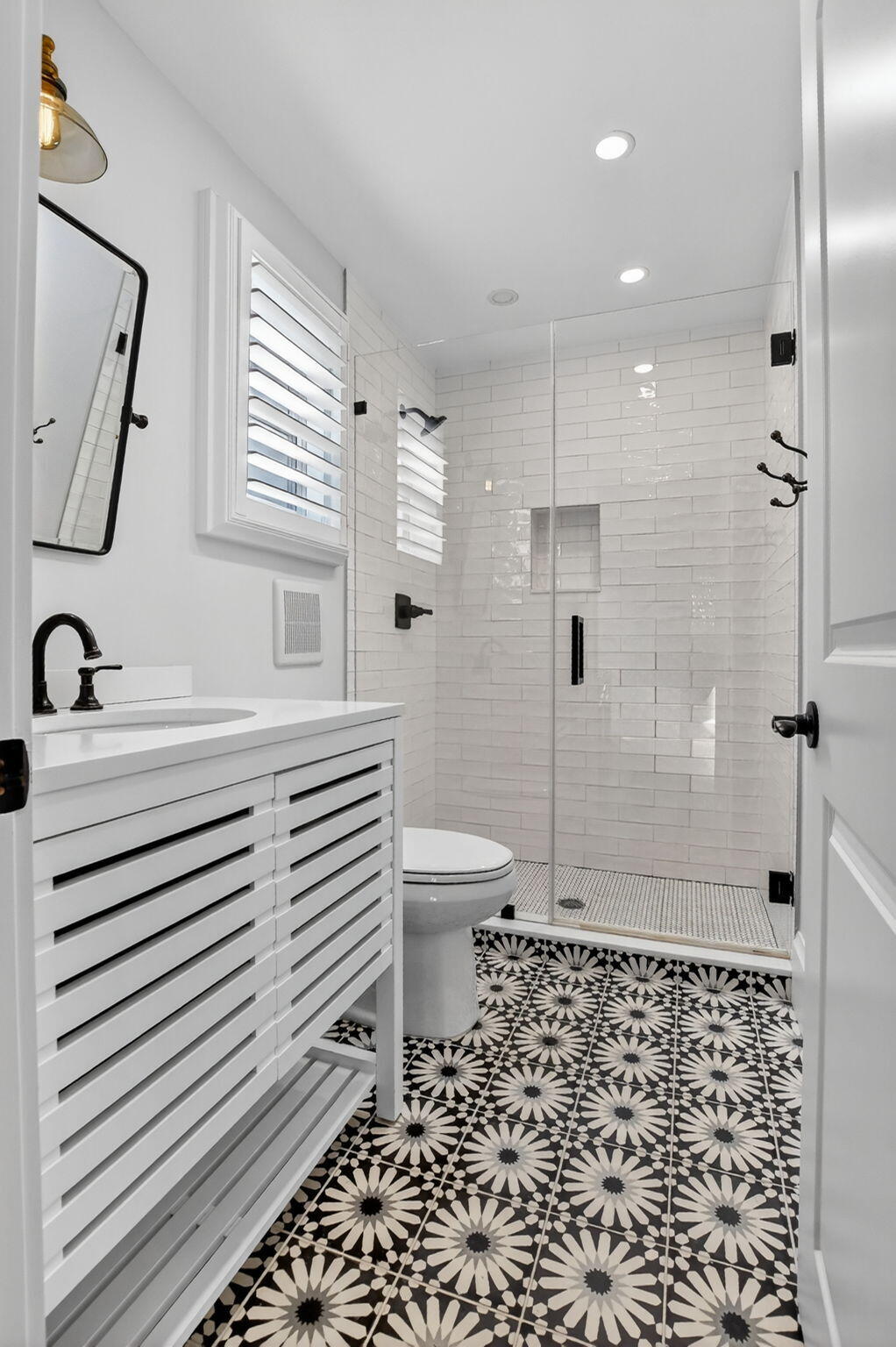 200 Northwest 10th Street Boca Raton, FL 33432 - Photo 68 of 83 a bathroom with a sink toilet a shower and a mirror