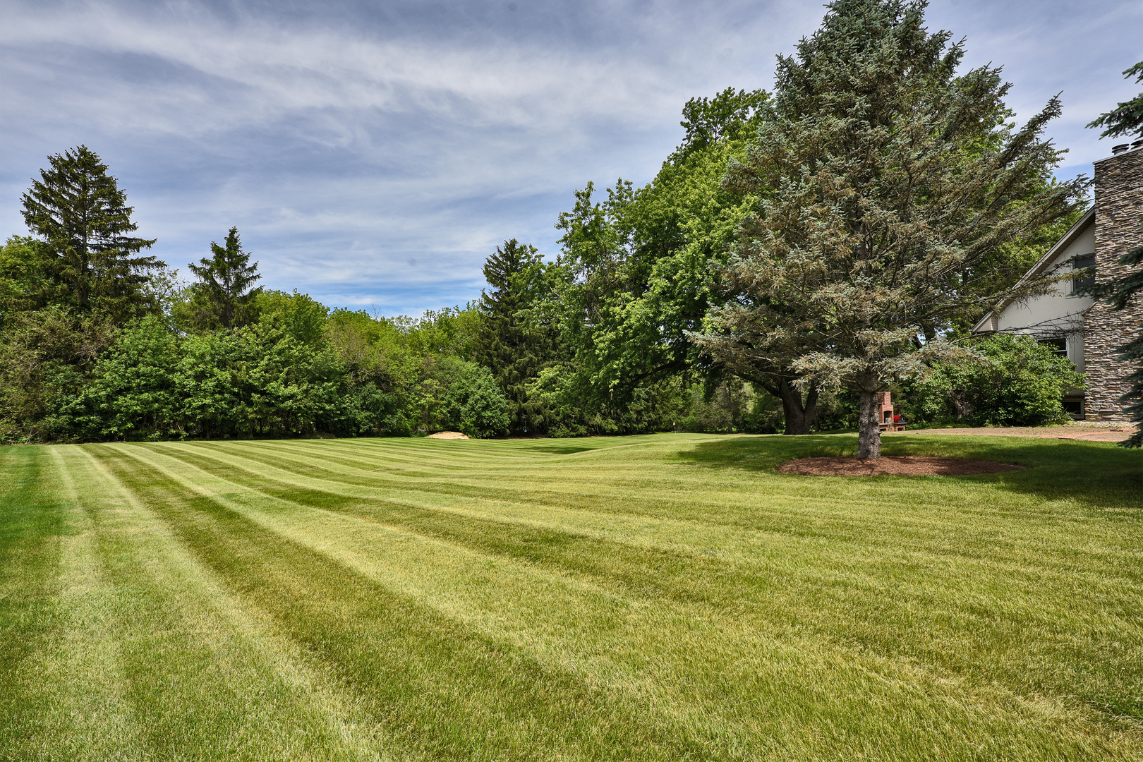 144 North Highland Road Inverness, IL 60067 - Photo 41 of 49 a view of a swimming pool with an outdoor space and seating area