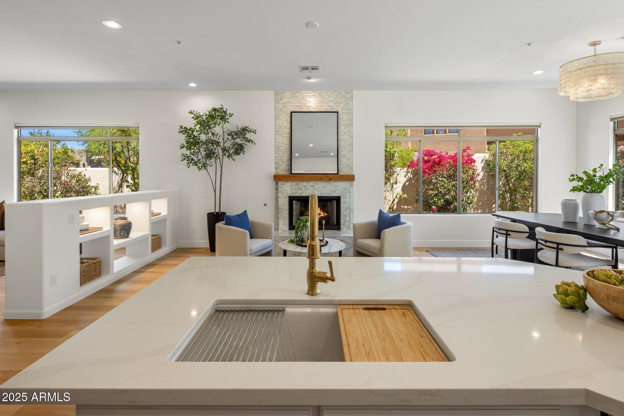 8227 East Beardsley Road Scottsdale, AZ 85255 - Photo 1 of 20 a living room with furniture and a fireplace