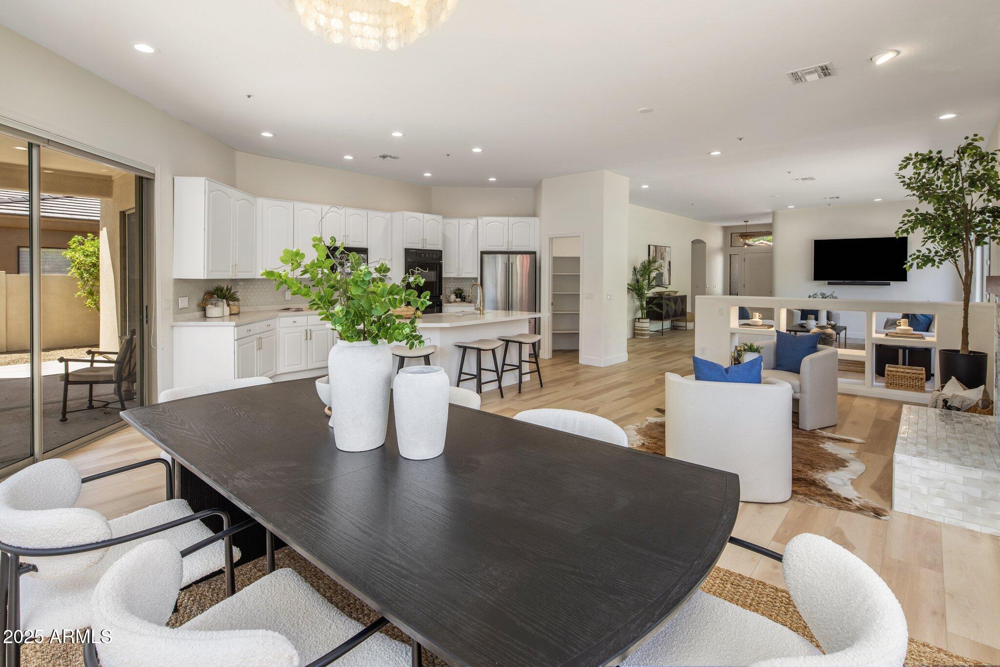 8227 East Beardsley Road Scottsdale, AZ 85255 - Photo 11 of 20 a living room with dining table a table and chairs