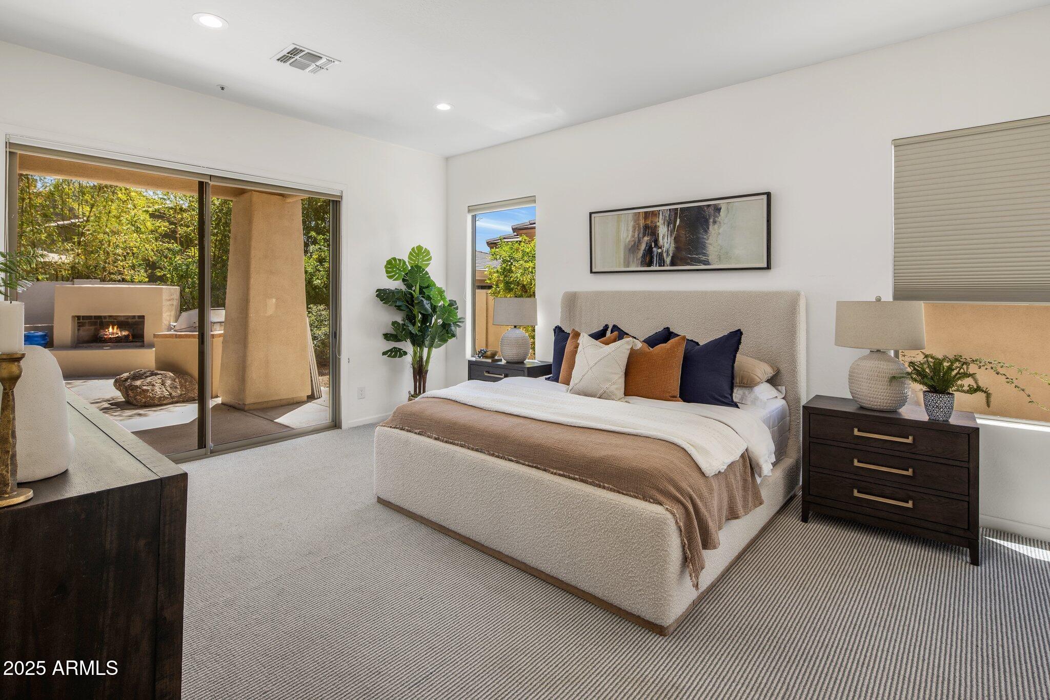 8227 East Beardsley Road Scottsdale, AZ 85255 - Photo 14 of 20 a spacious bedroom with a bed and a dresser