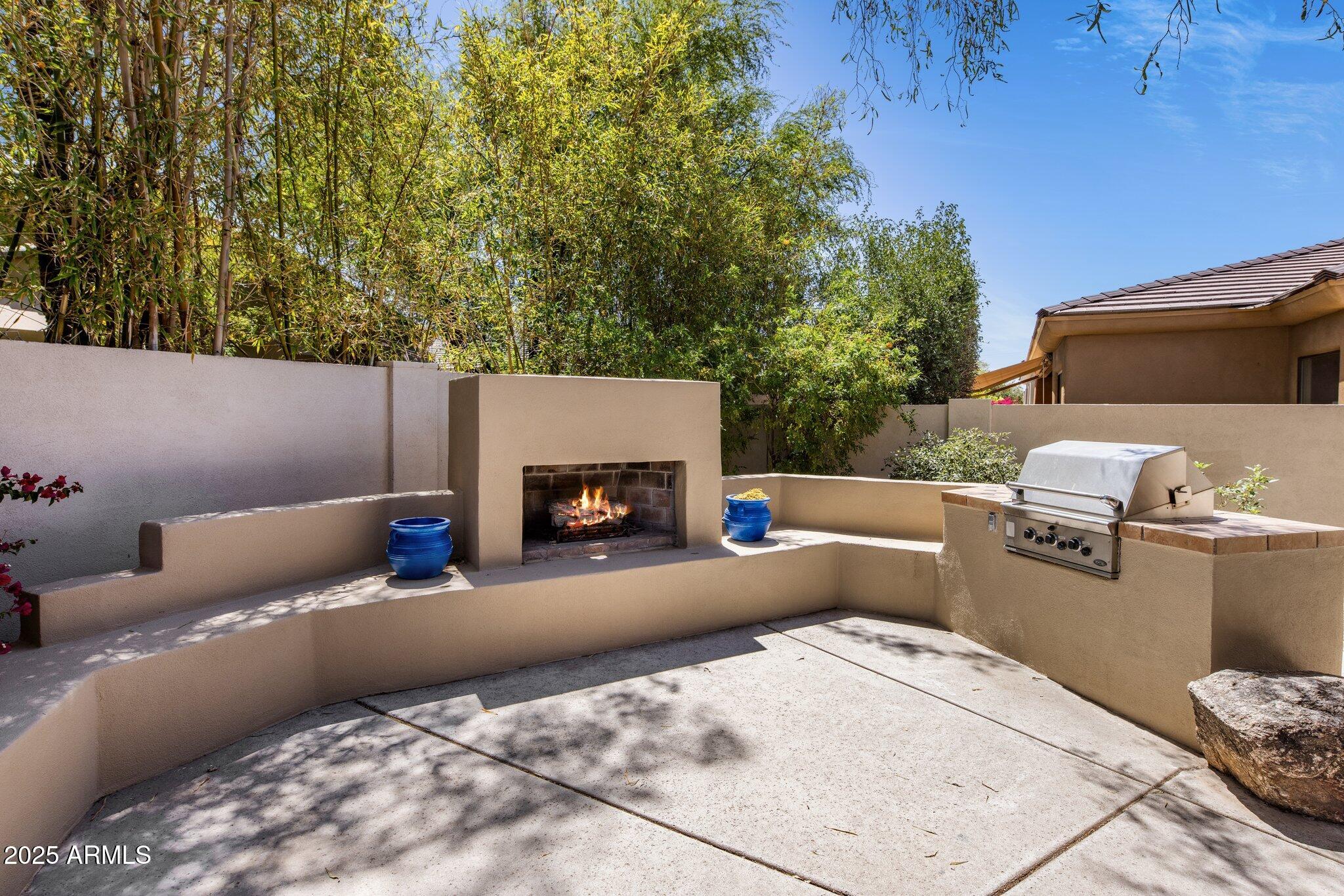 8227 East Beardsley Road Scottsdale, AZ 85255 - Photo 17 of 20 a living room with furniture and a fireplace