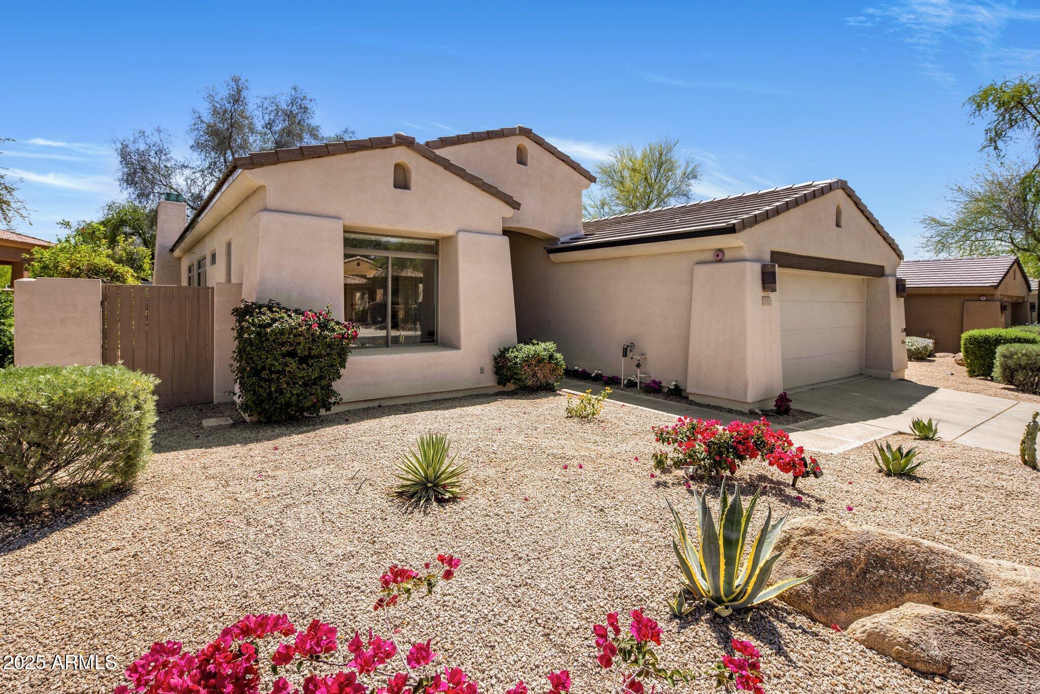 8227 East Beardsley Road Scottsdale, AZ 85255 - Photo 20 of 20 a front view of a house with a yard