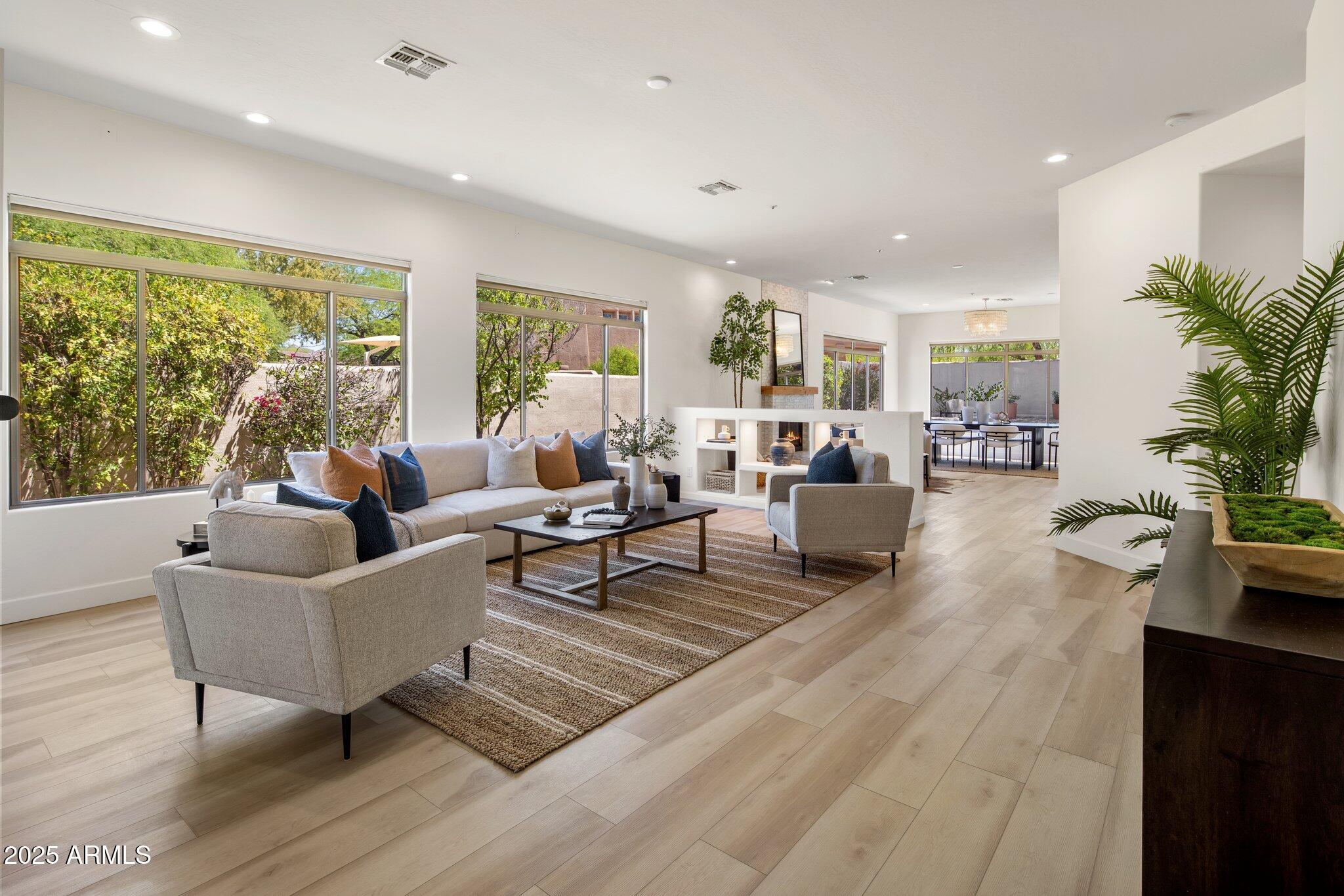 8227 East Beardsley Road Scottsdale, AZ 85255 - Photo 4 of 20 a living room with furniture and a large window