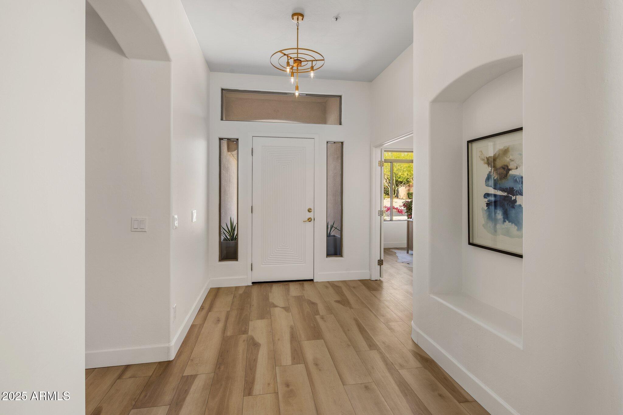 8227 East Beardsley Road Scottsdale, AZ 85255 - Photo 5 of 20 a view of livingroom with hardwood floor and hallway