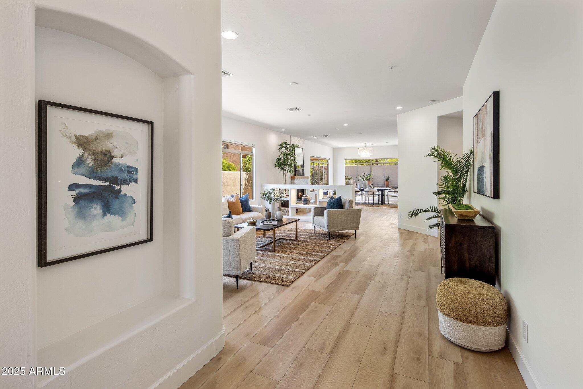 8227 East Beardsley Road Scottsdale, AZ 85255 - Photo 6 of 20 a living room with furniture and a painting on the wall