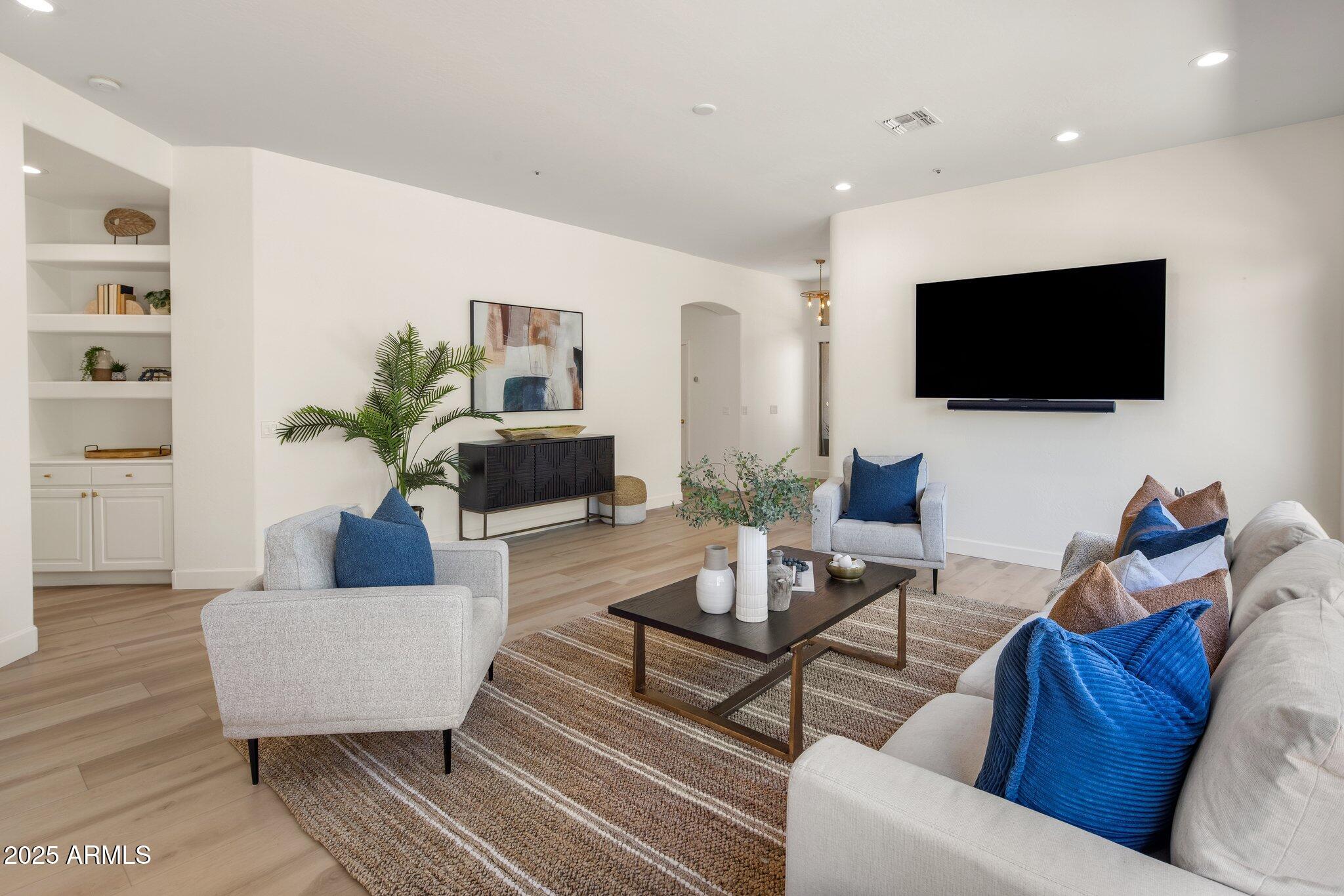 8227 East Beardsley Road Scottsdale, AZ 85255 - Photo 7 of 20 a living room with furniture and a flat screen tv