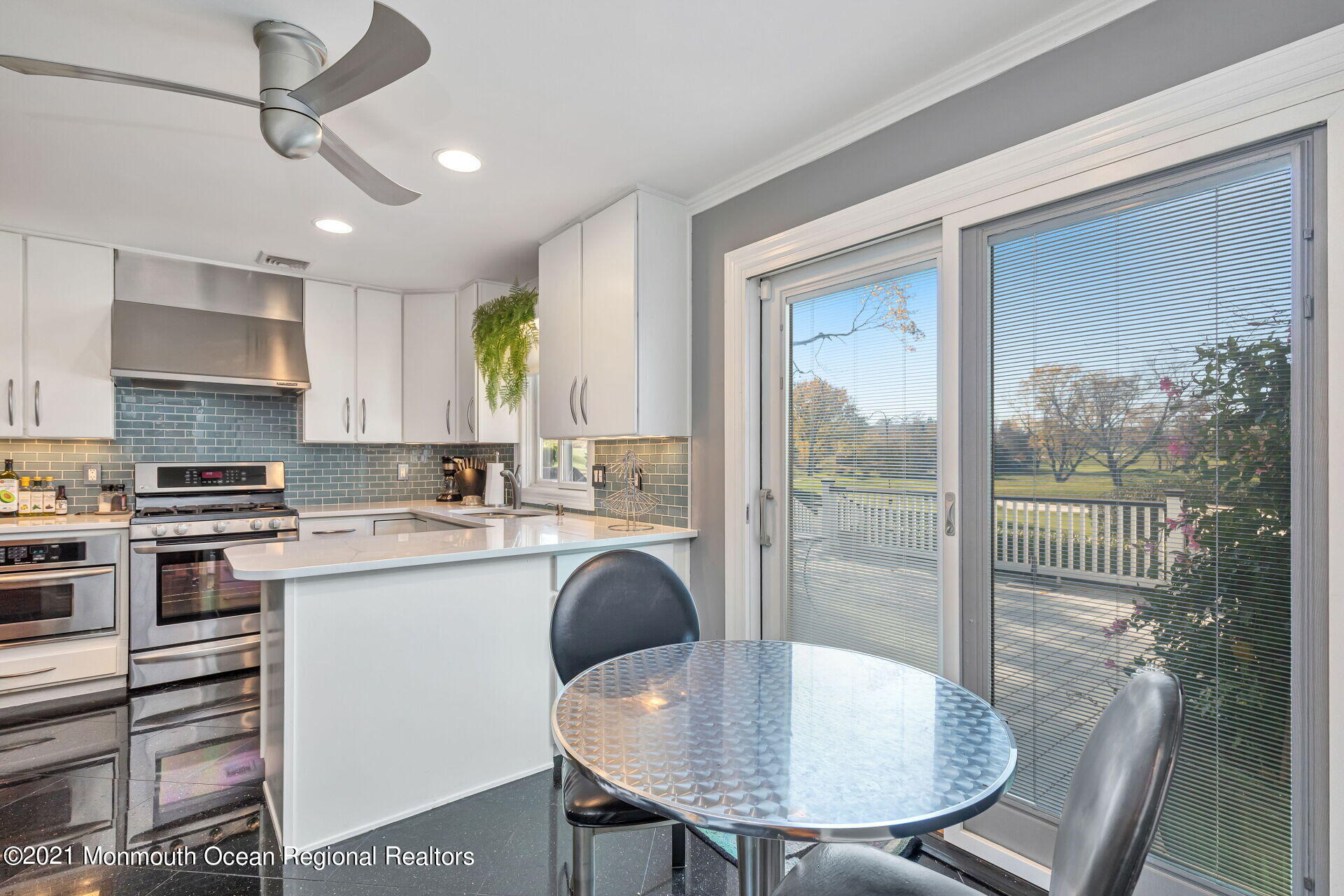 81 Portland Road Atlantic Highlands, NJ 07716 - Photo 13 of 65 a kitchen with kitchen island a stove a table and chairs