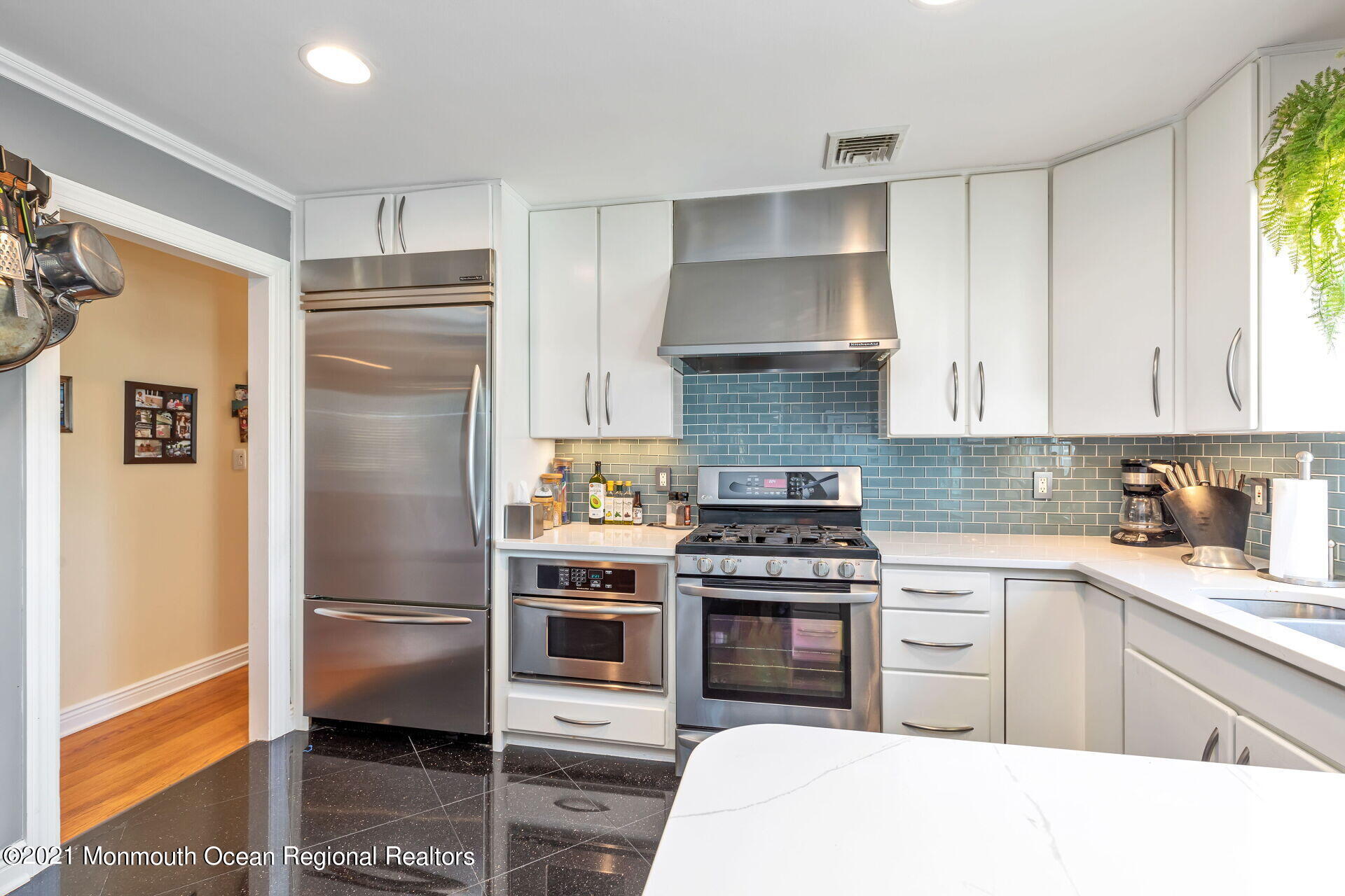 81 Portland Road Atlantic Highlands, NJ 07716 - Photo 14 of 65 a kitchen with stainless steel appliances a stove a refrigerator and a sink