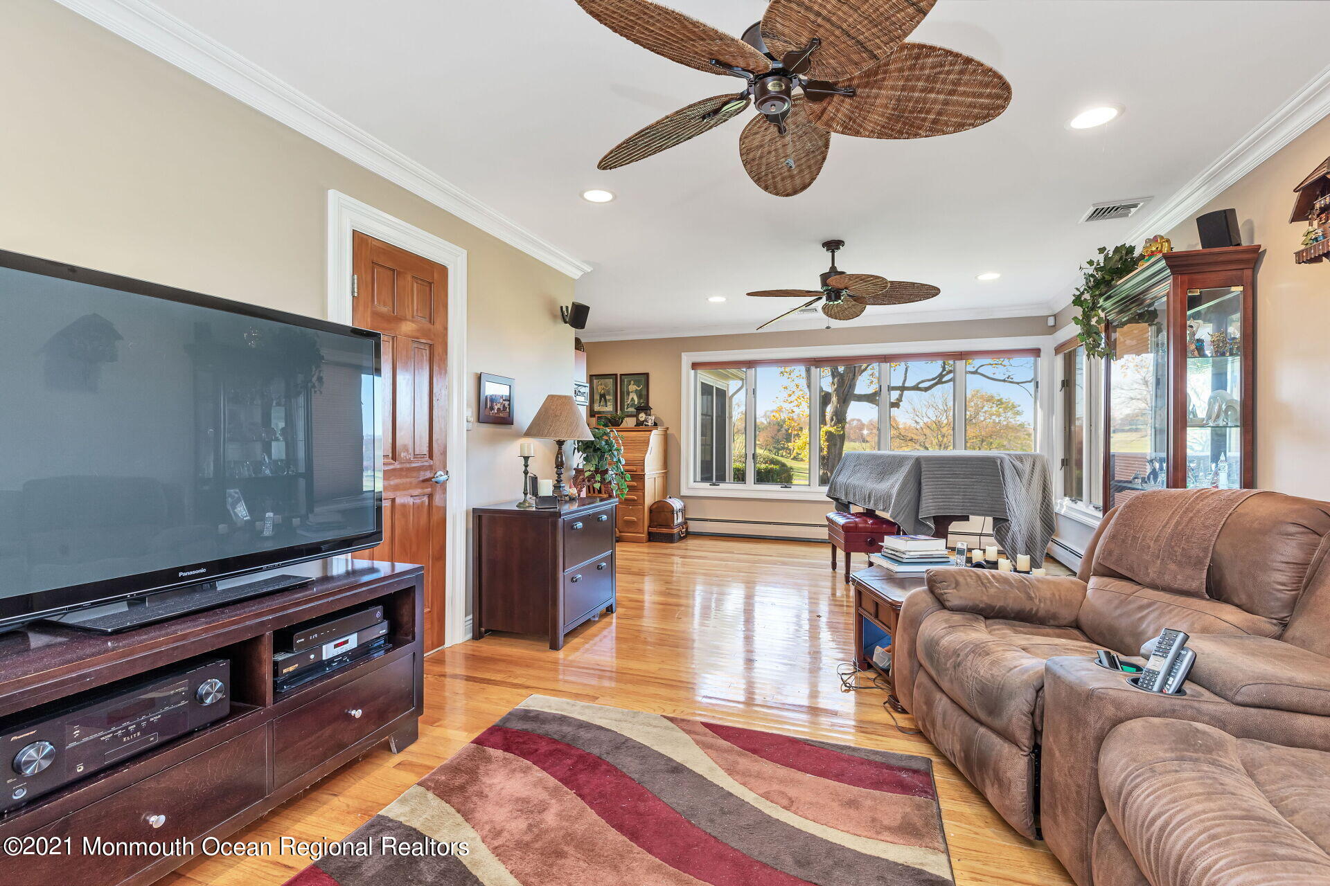 81 Portland Road Atlantic Highlands, NJ 07716 - Photo 25 of 65 a living room with furniture a chandelier and a piano
