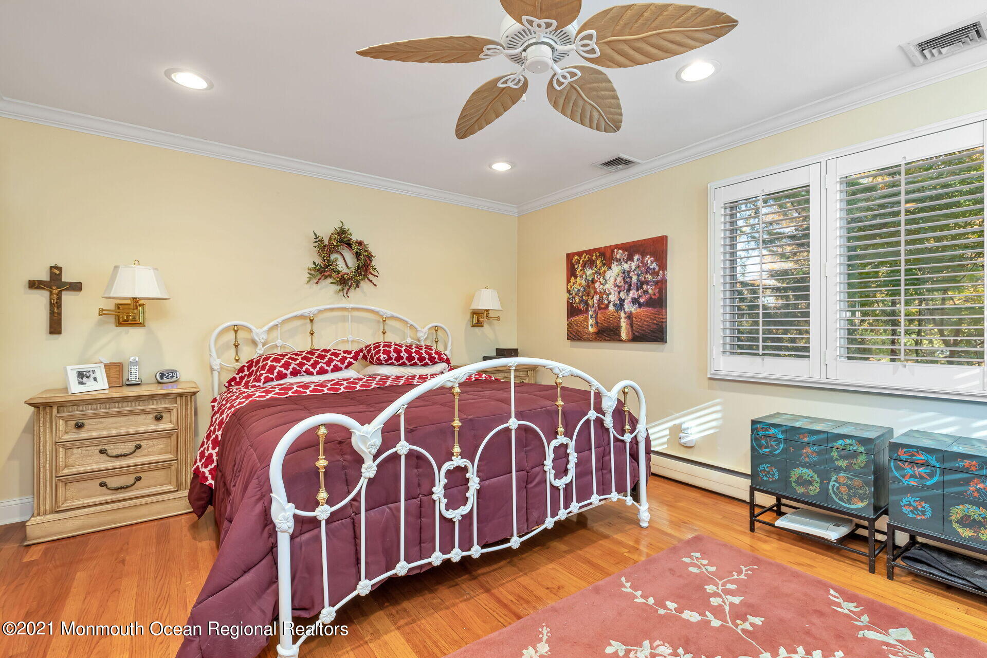 81 Portland Road Atlantic Highlands, NJ 07716 - Photo 30 of 65 a spacious bedroom with a bed and a chandelier