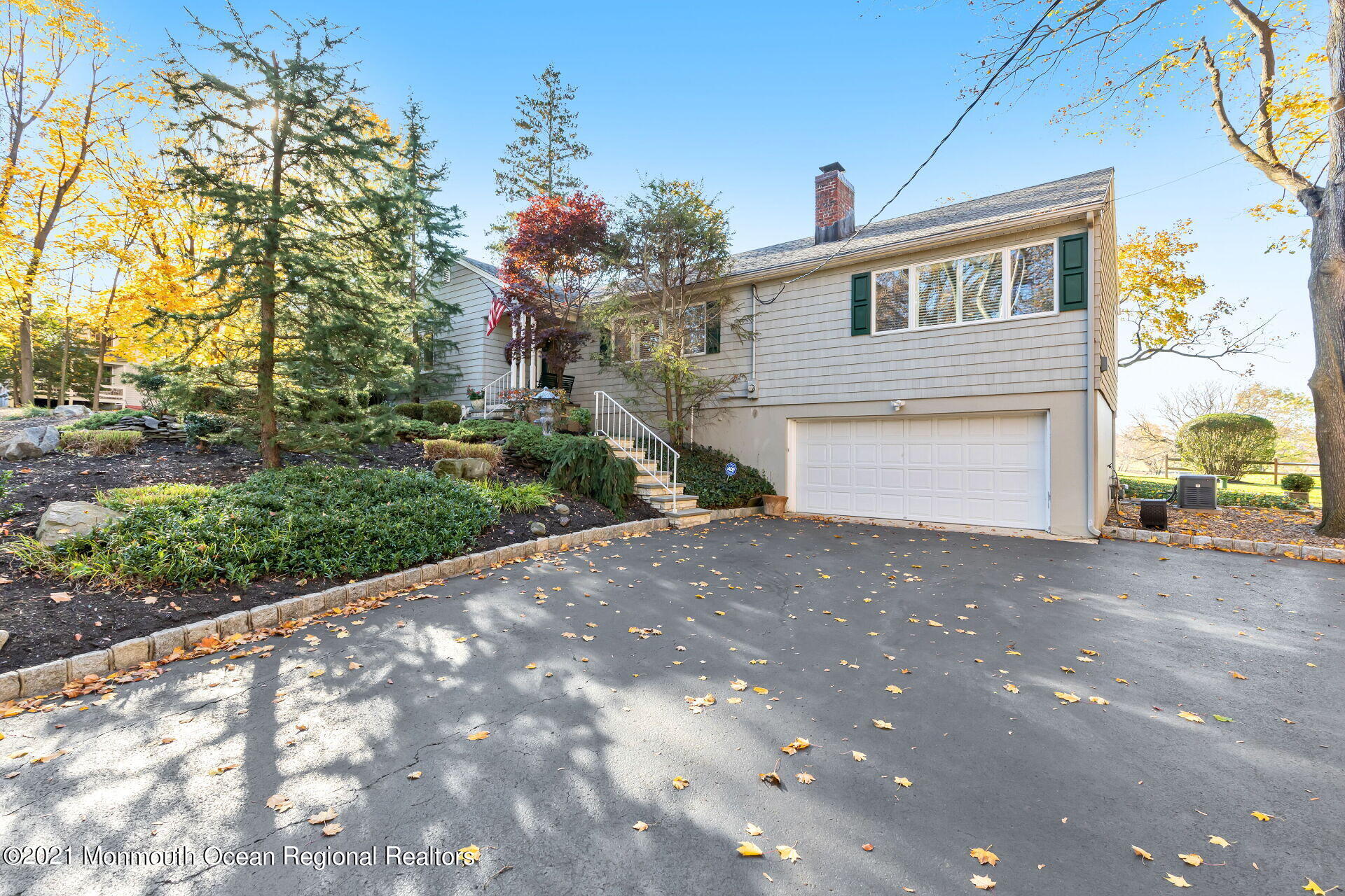 81 Portland Road Atlantic Highlands, NJ 07716 - Photo 39 of 65 a view of a house with a yard and garage