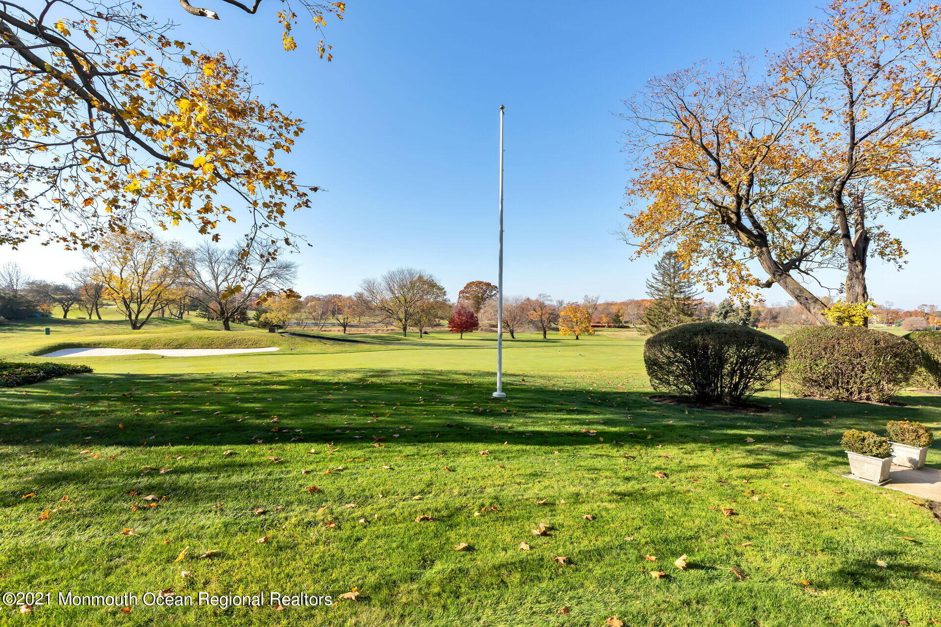 81 Portland Road Atlantic Highlands, NJ 07716 - Photo 5 of 65 a view of a golf course with a lake