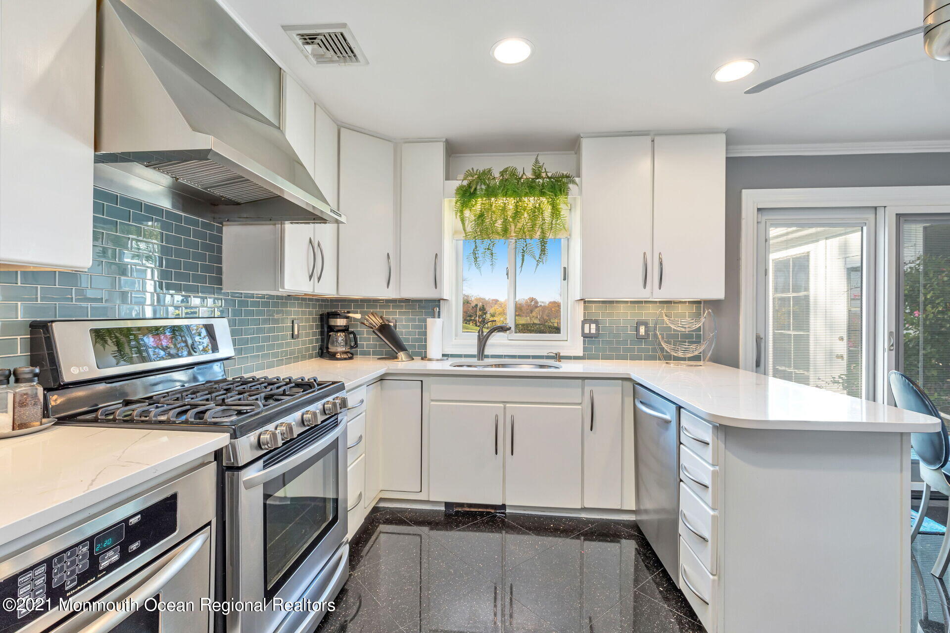 81 Portland Road Atlantic Highlands, NJ 07716 - Photo 10 of 65 a kitchen with a stove a sink and a refrigerator