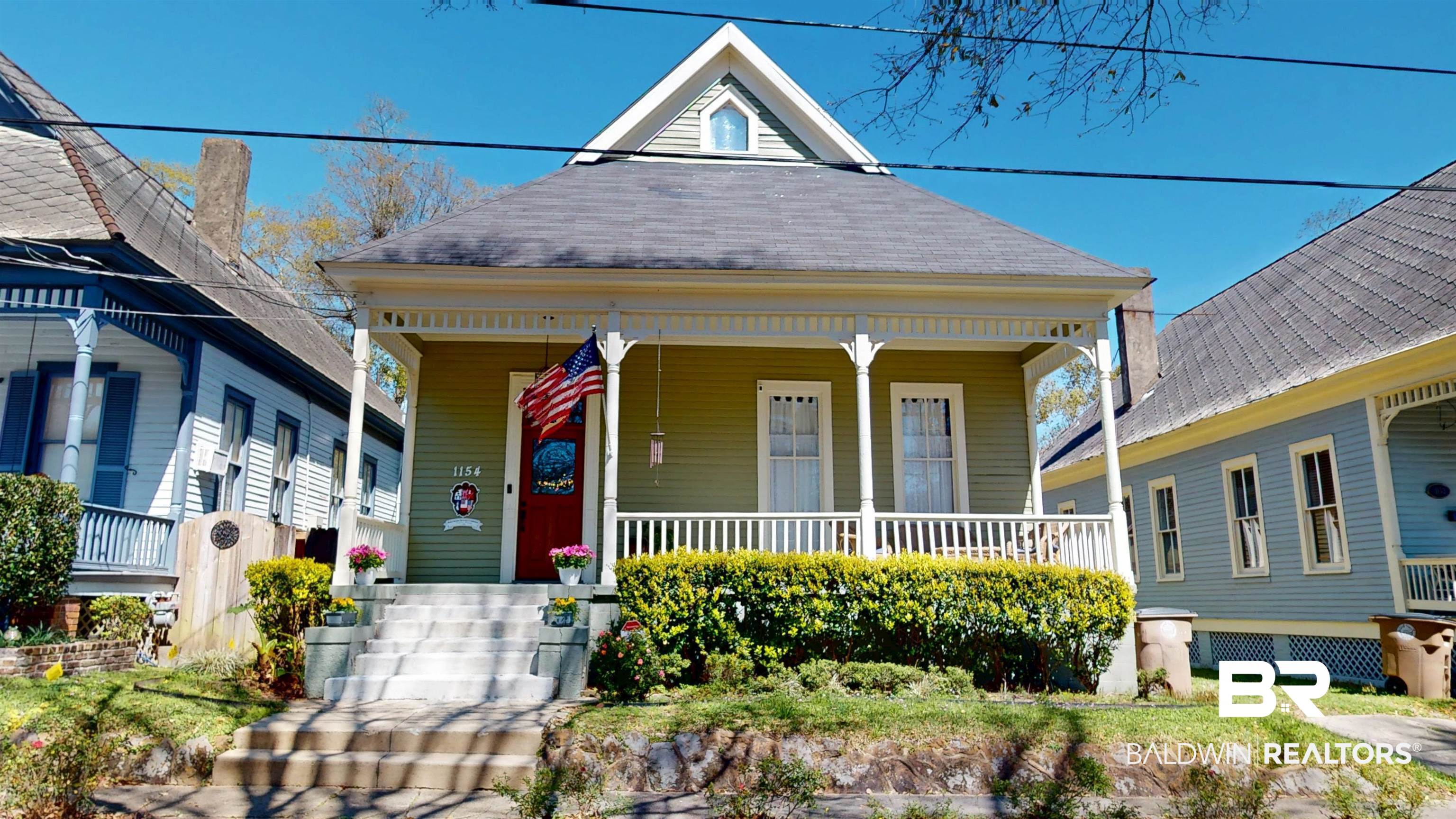 1154 New St Francis Street Mobile, AL 36604 - Photo 1 of 37 View of front facade with covered porch and a shingled roof