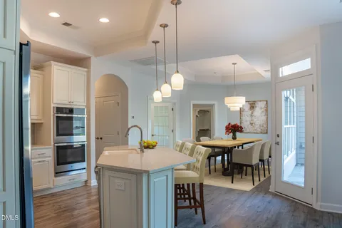 a kitchen with stainless steel appliances granite countertop a refrigerator sink and cabinets