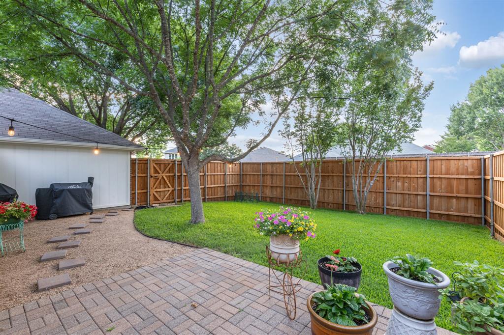 915 Rutgers Court Allen, TX 75002 - Photo 4 of 39 The backyard retreat continues the care and attention to detail. Large patio with pavers, crushed granite gravel extension, new fence, lush grass and mature trees create a serene setting.