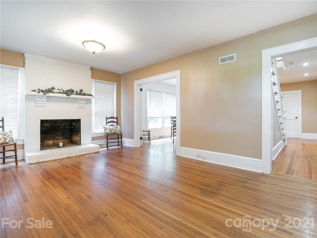 3514 Kelly Road Charlotte, NC 28216 - Photo 11 of 34 a view of a livingroom with wooden floor and a fireplace